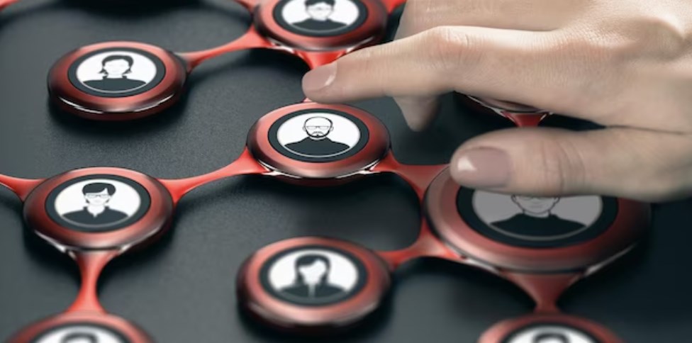 a finger pressing an avatar to select a contact inside a business network
